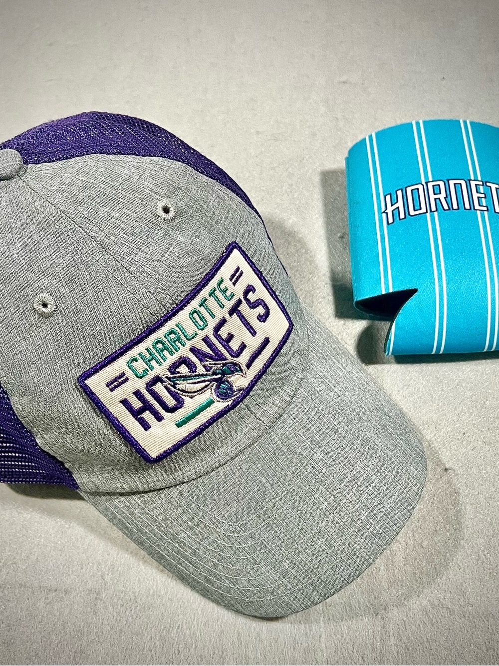 Charlotte Hornets Purple & Gray Mesh Trucker Cap and can cooler